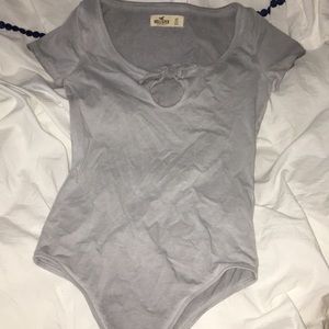 light grey bodysuit with a tie in front